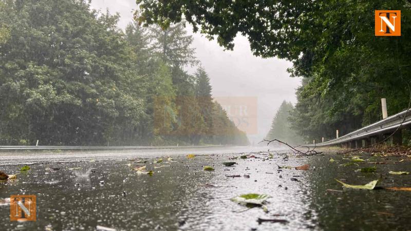 Cloudy Skies and Showers Have Citizens Switching Between Raincoats and Coolers